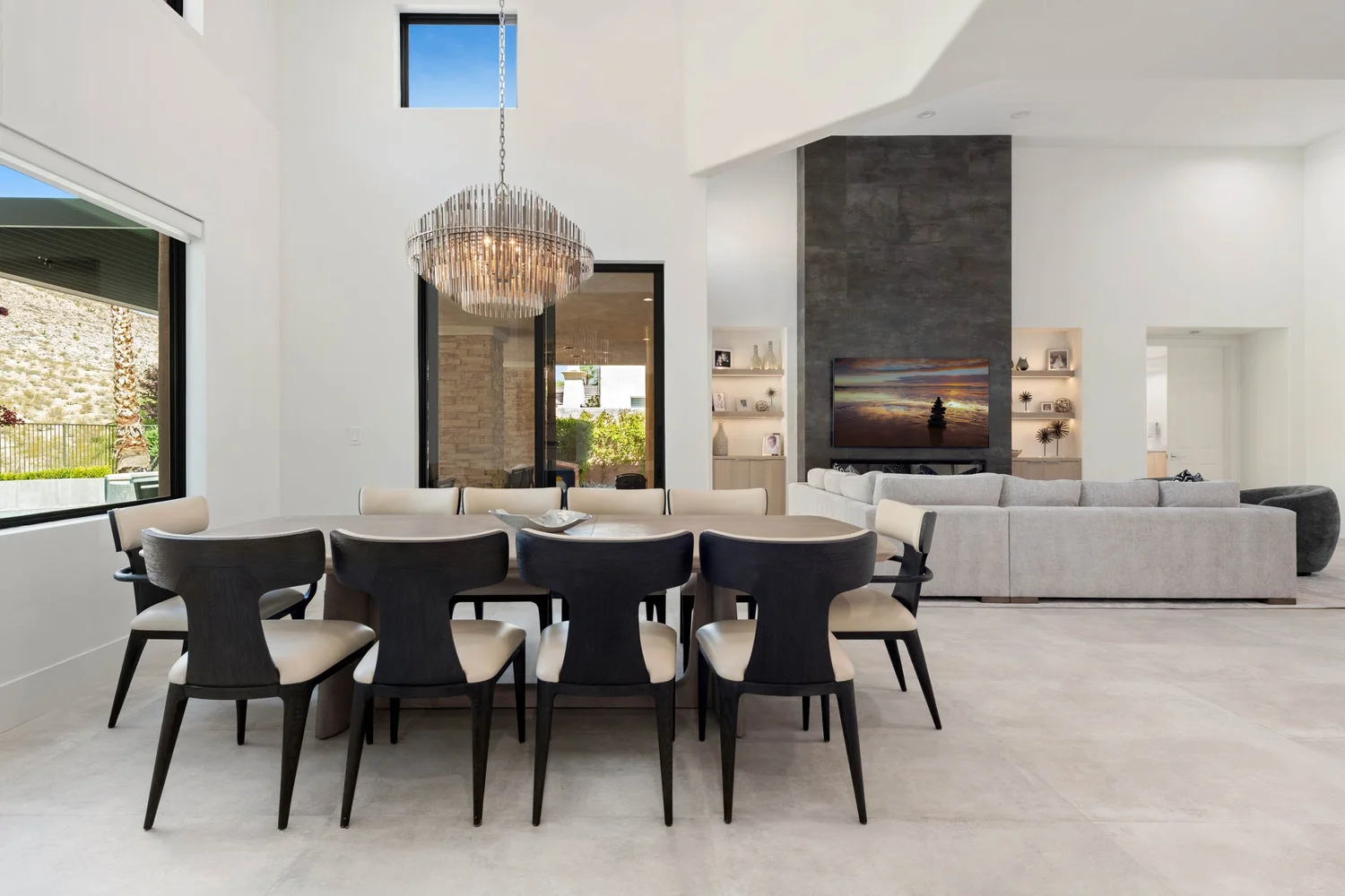 Red Rock Foothills dining room — long table under a tiered glass chandelier