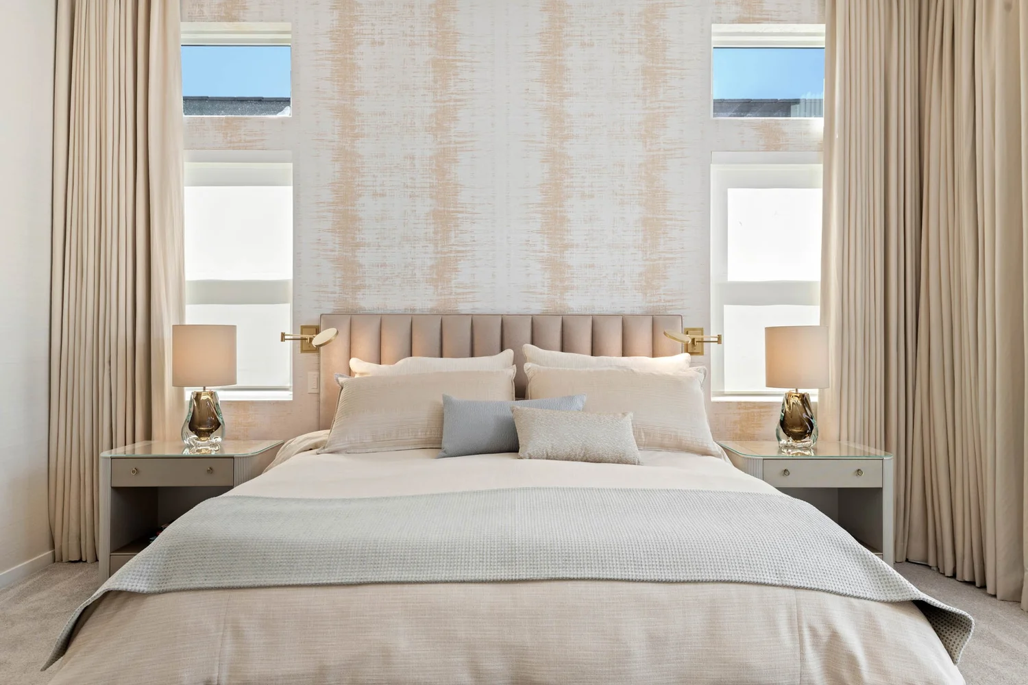 Mesa Abhaile bedroom — channel-tufted headboard with textured wallpaper